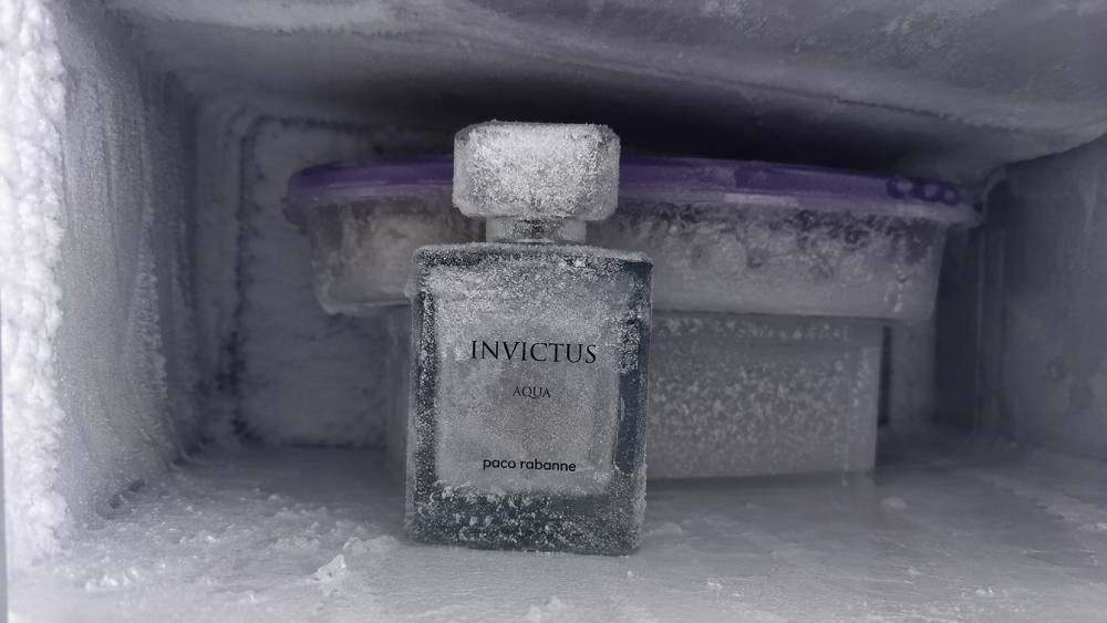 A photograph of a frozen perfume bottle inside a samsung freezer to test if freezing stops the smell
