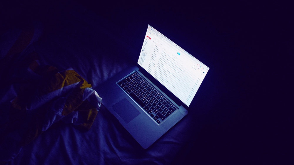Photo of a laptop being used in a private session at night